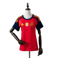 Maillot Espagne Home 26/27 femme avec deux étoiles et l'écusson de champion du monde